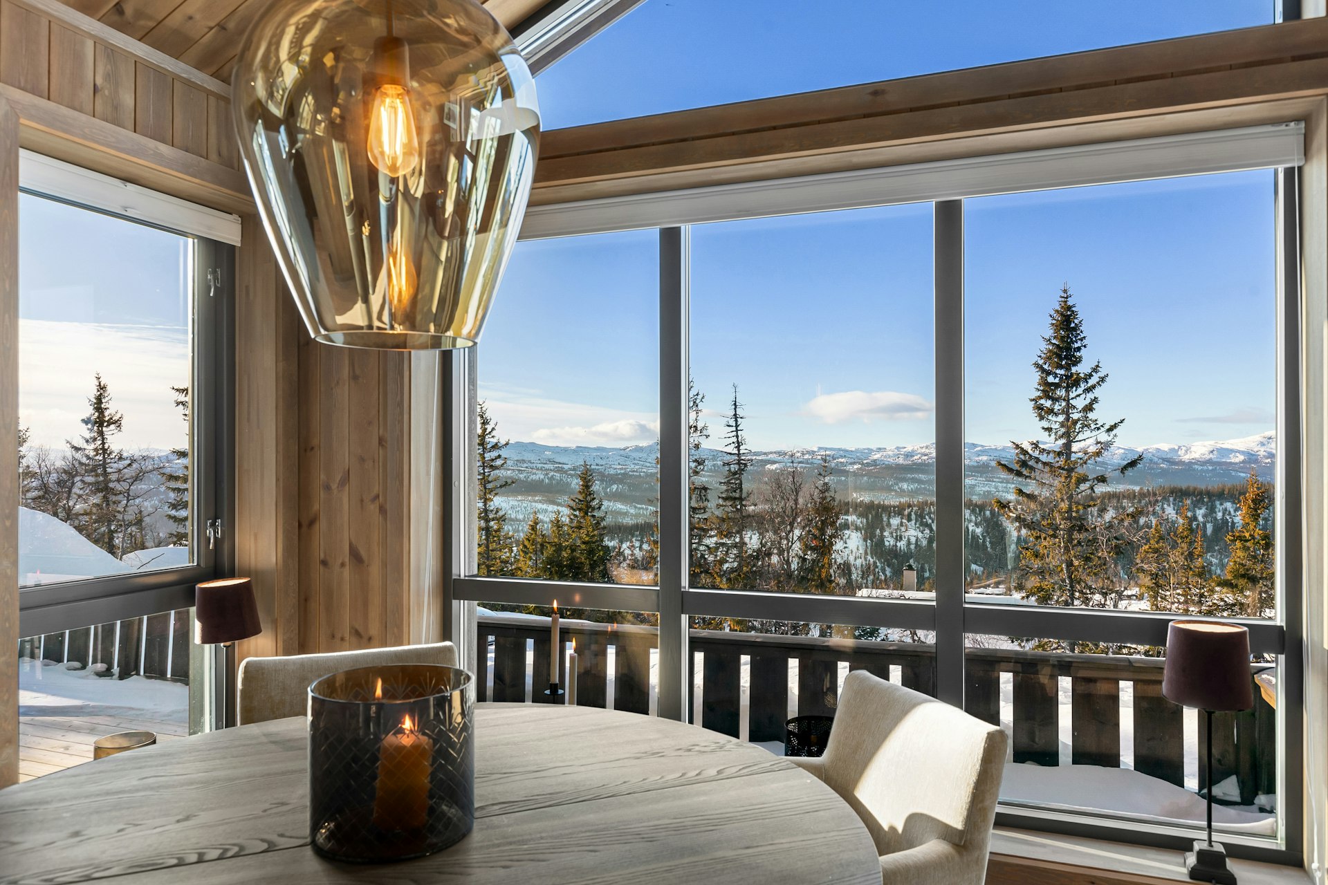 A dining room table with a view of the mountains
